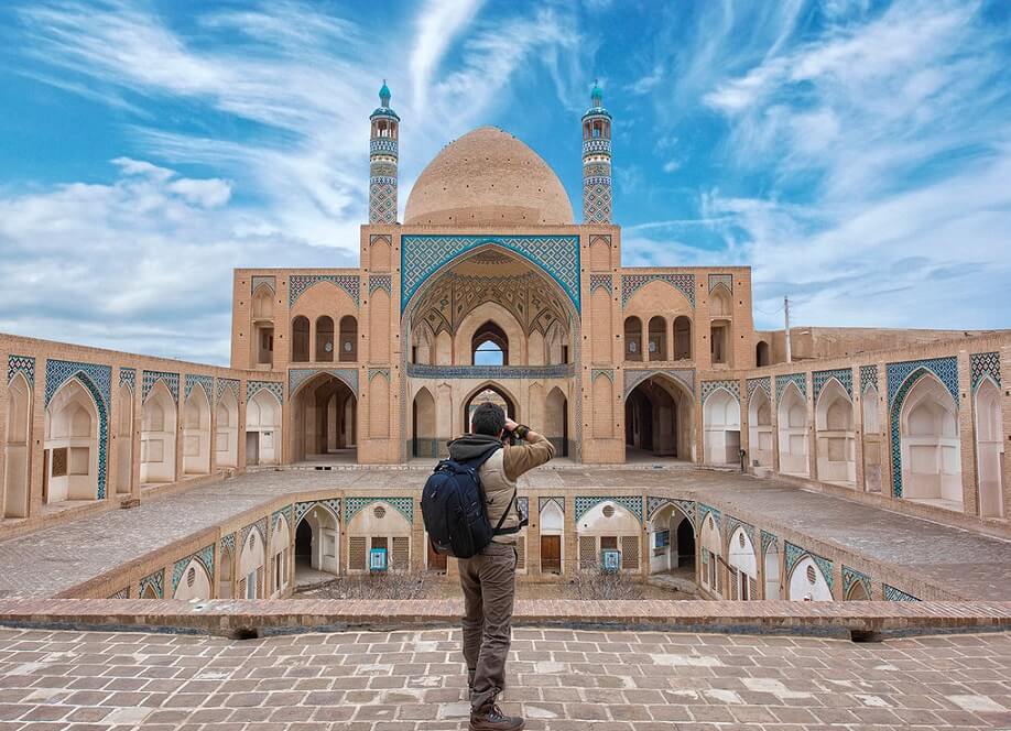 travelers in Agha Bozorg Mosque to take photo